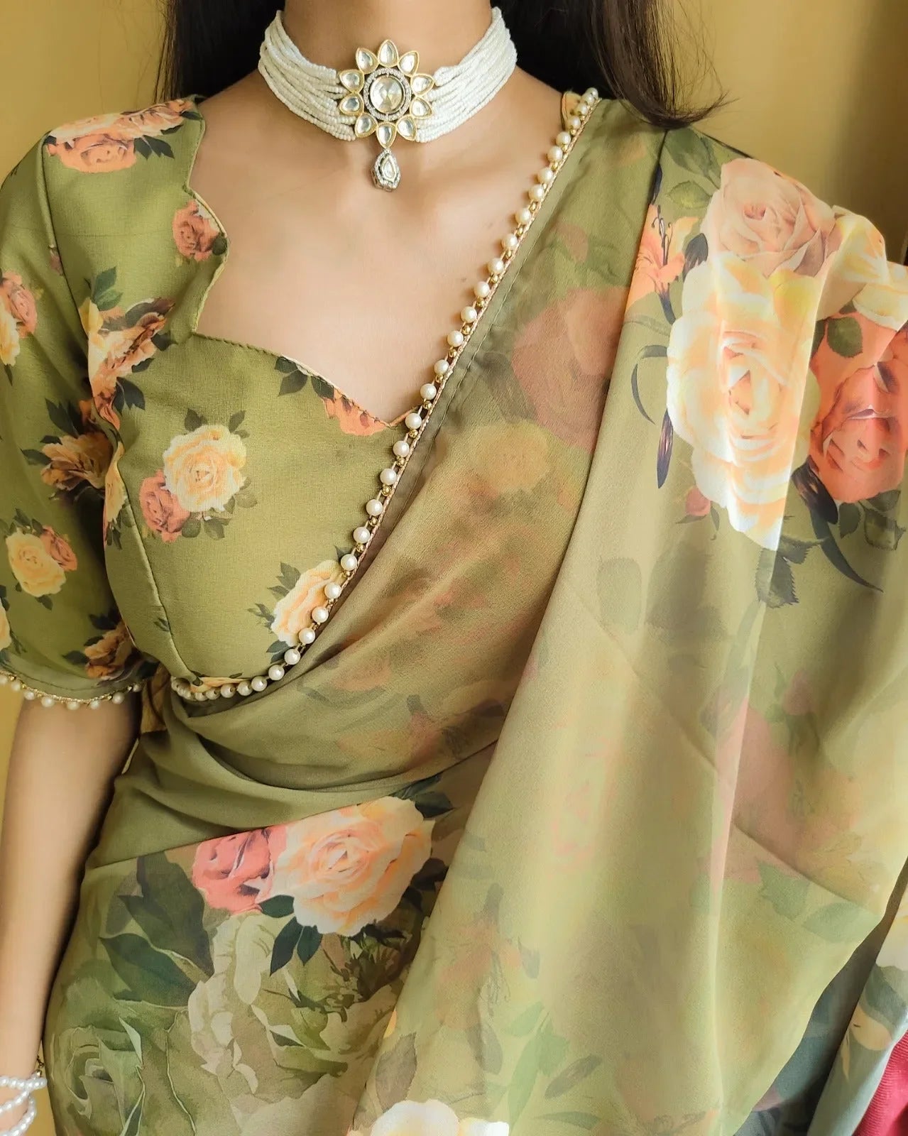 Elegance Redefined Georgette Printed Saree with Pearl Lace