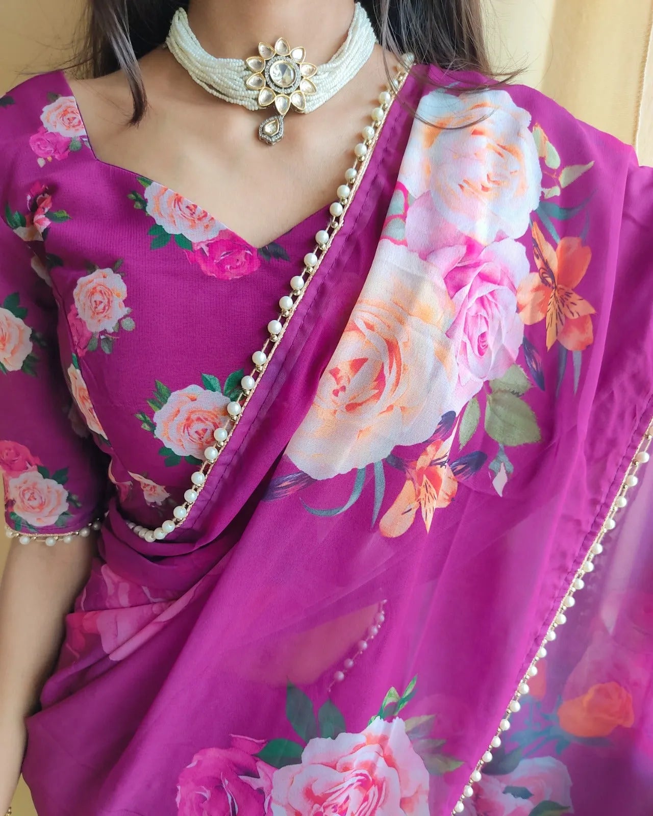 Elegance Redefined Georgette Printed Saree with Pearl Lace